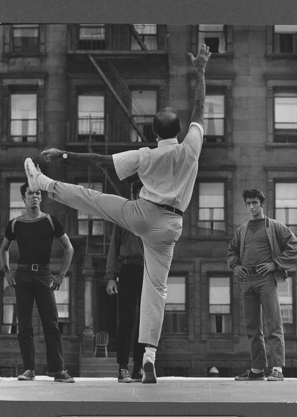 Jerome Robbins directing Jay Norman, George Chakiris and Eddie Verso during the filming of “West Side Story,” Jerome Robbins Dance Division, The New York Public Library for the Performing Arts. 