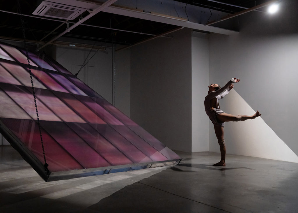 Etay Axelroad in “Heron” with Guillaume Linard Osorio’s installation at Carvalho, New York. Photograph by Quinn Wharton and courtesy of Carvalho, New York